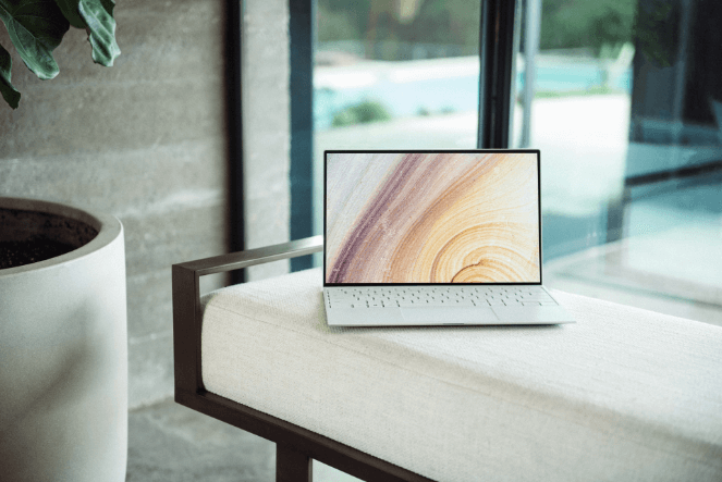 A stock photo of a laptop on a chair 